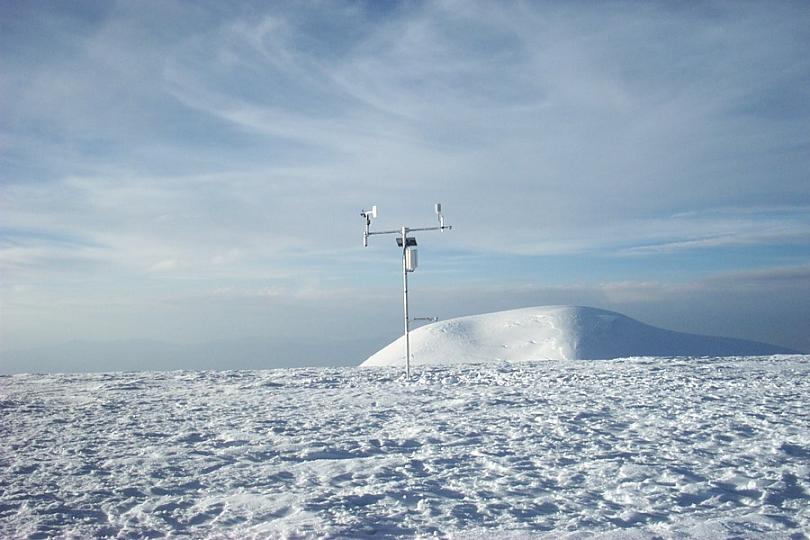 A large piece of technology is positioned in the vast snowy landscape of Coropuna, Peru.
