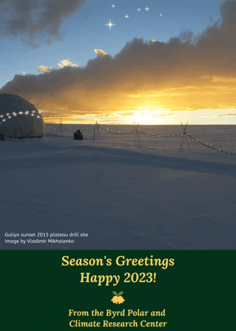 image caption on bottom left says Guluya sunset 2015 plateau drill site  image by Vladimir Mikhalenko with a domed tent and rope hanging from stakes with colorful twinkling lights on it and dome with a yellow blue sky and some starts with a snowy vista wishing Seasons greeting under image with gold lettering and bell with holly from the Byrd Polar and Climate Research Center
