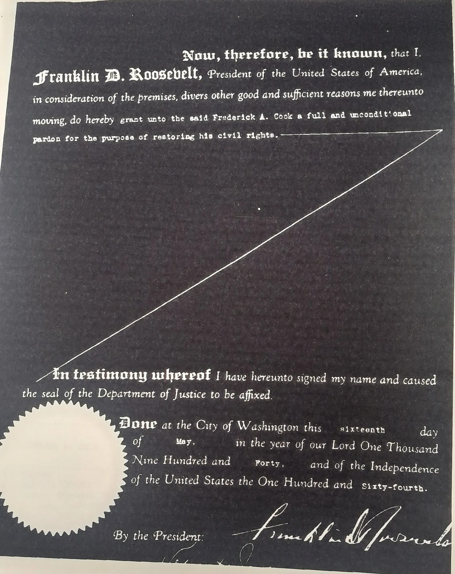 An old document in black and whiter with a golden seal at the bottom.