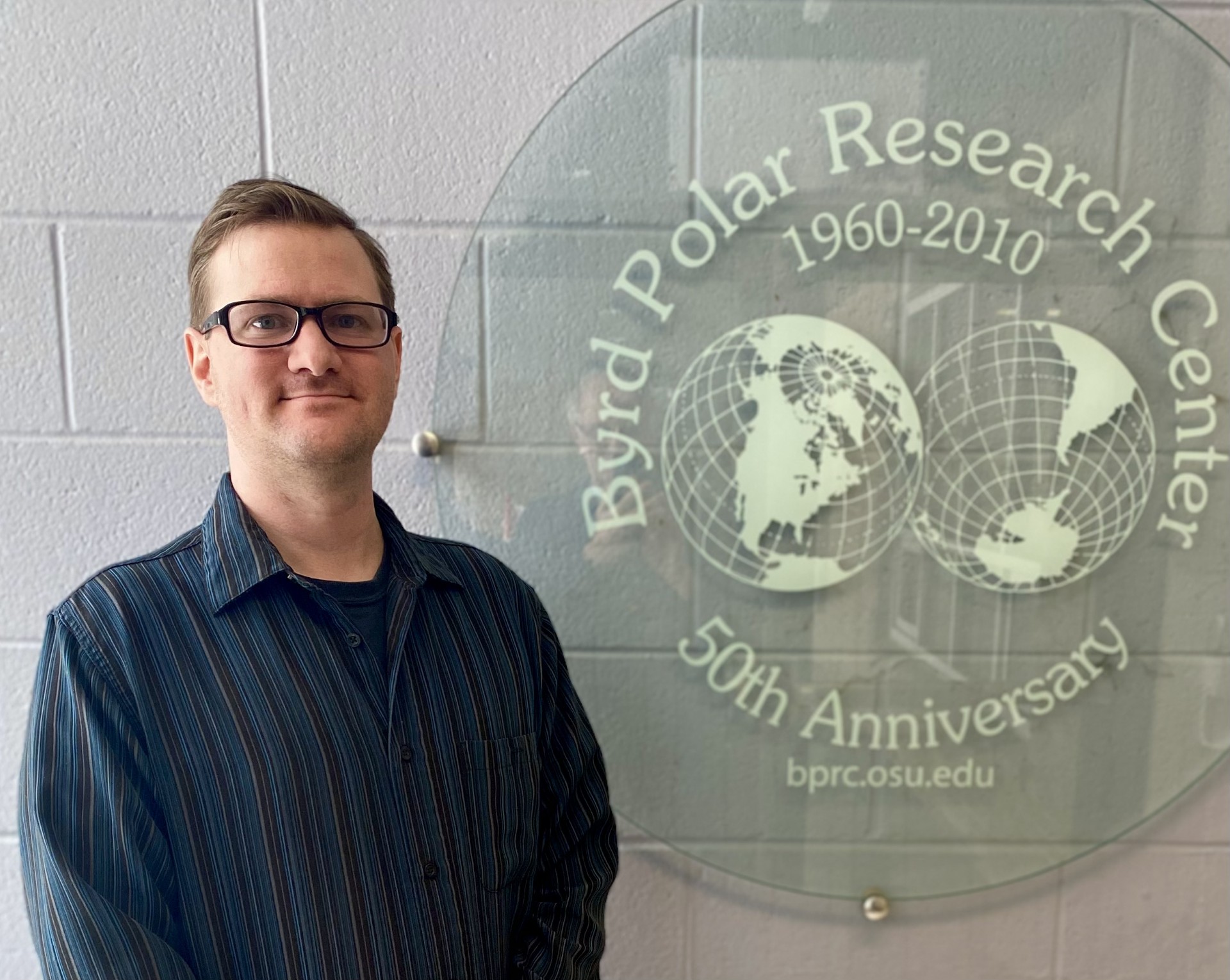 Brian Rakoczy in front of Byrd Polar and Climate Research Sign