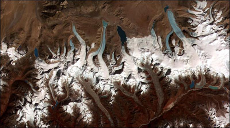 This ASTER image shows the lakes left behind by retreating glaciers in the Bhutan-Himalaya.  Jeffrey Kargel / USGS/NASA