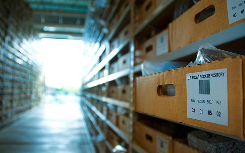 Focused photo on box positioned on one of the many shelves in the Byrd Polar and Climate Rock Repository 