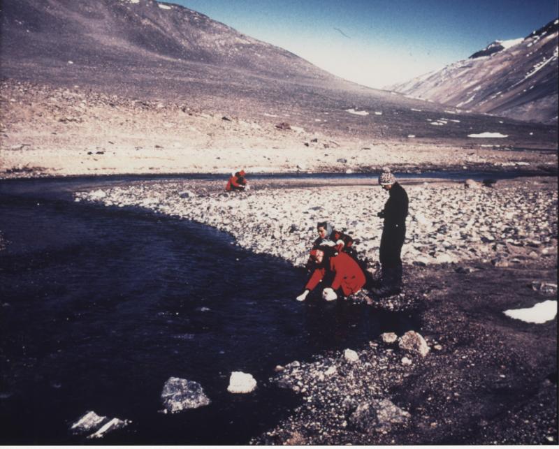 Team members sampling water in the Dry Valleys of Antarctica