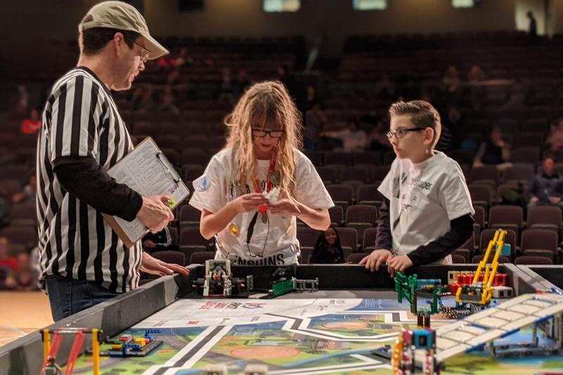Two lego league teammates at a competition