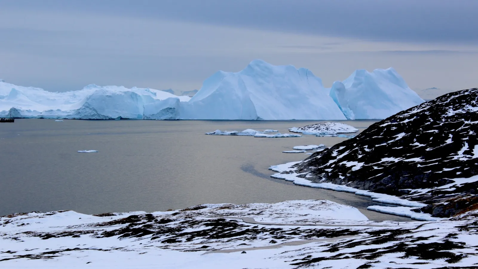 Icebergs near Greenland form from ice that has broken off--or calved--from glaciers on the island. 