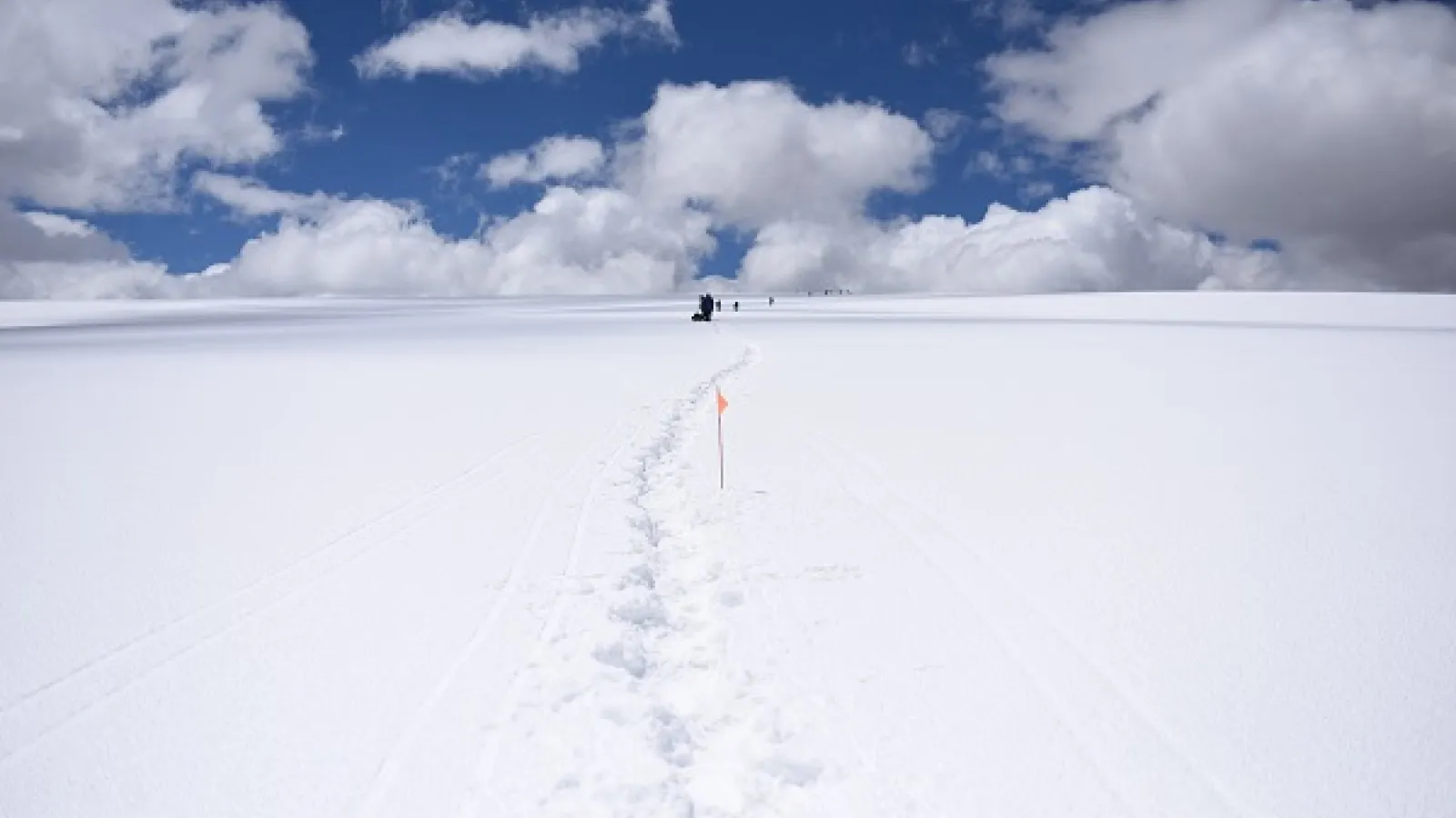 Quel. team members approaching the 18,670 ft summit of the Quelccaya in 2018