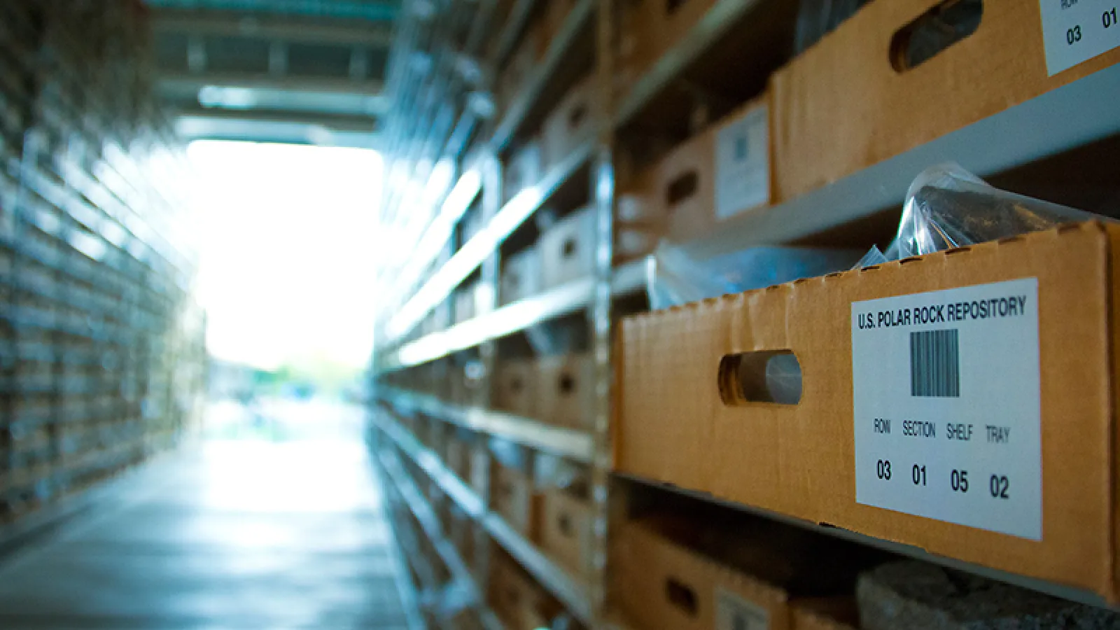 Focused photo on box positioned on one of the many shelves in the Byrd Polar and Climate Rock Repository 