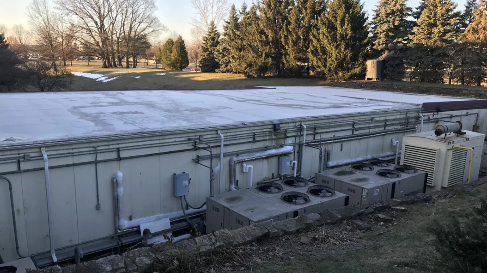 Refrigeration units are located outside and are very outdated.