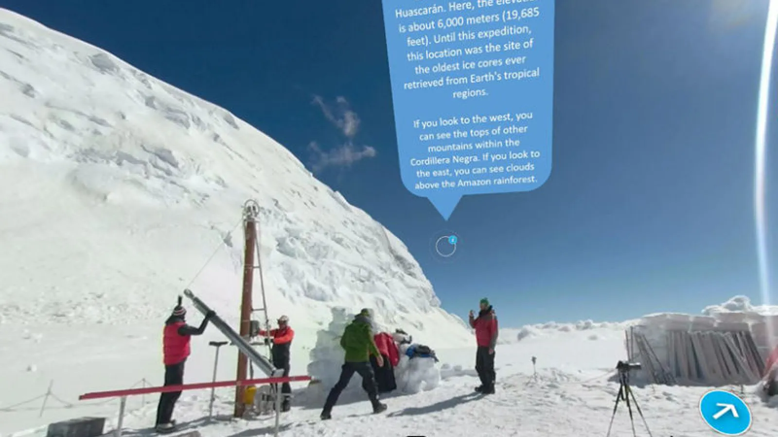Researchers set up field technology beside a glacier with a blue world cloud above their heads