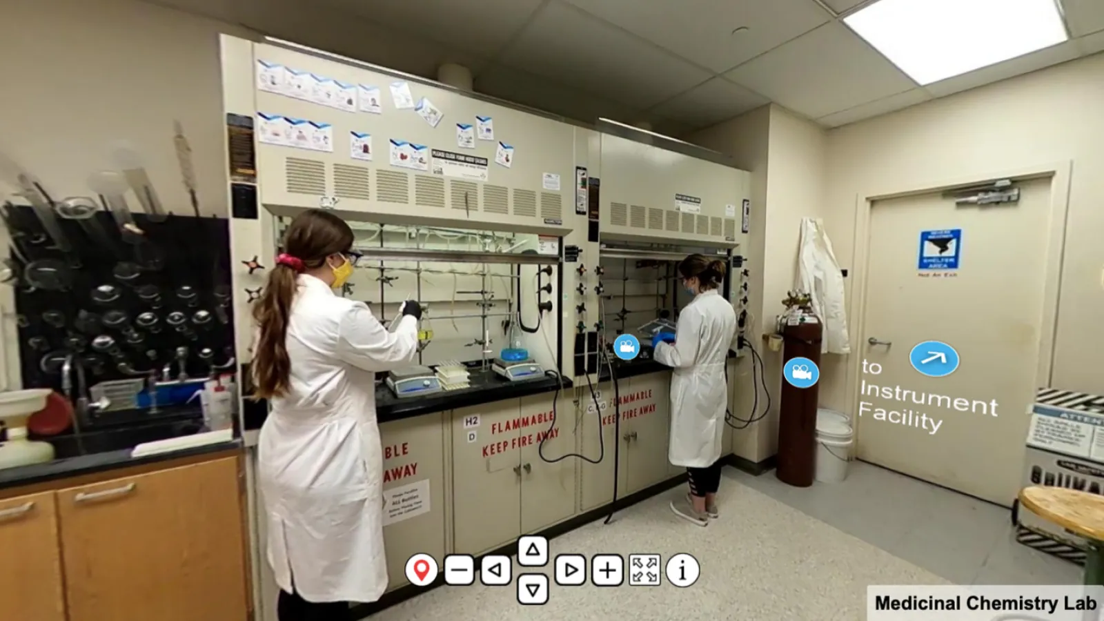 Scientist work in a lab in their lab coats