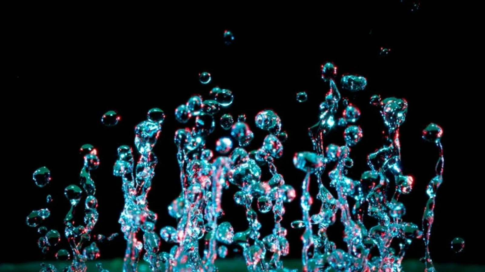 A microphotograph of moving drops of water.