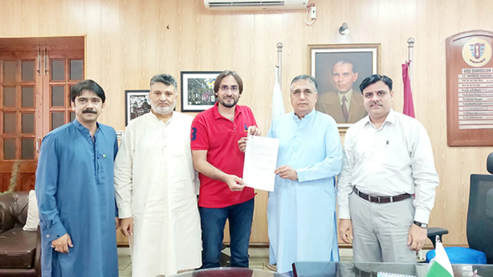 Dr Fazlul Haq recieving award letter and letter of appreciation.