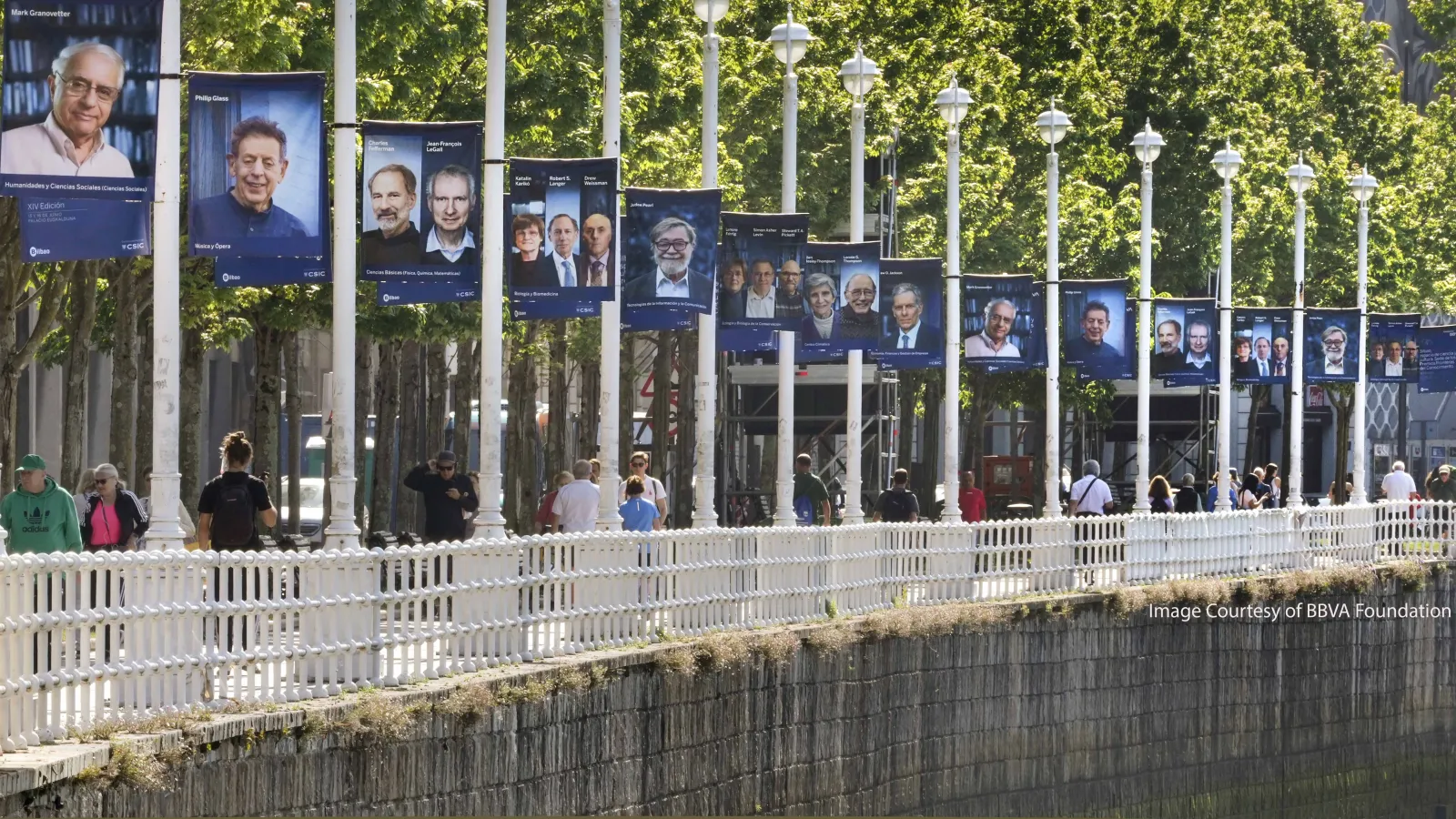 Treelined Bridge with flags of BBVA award recipient images 