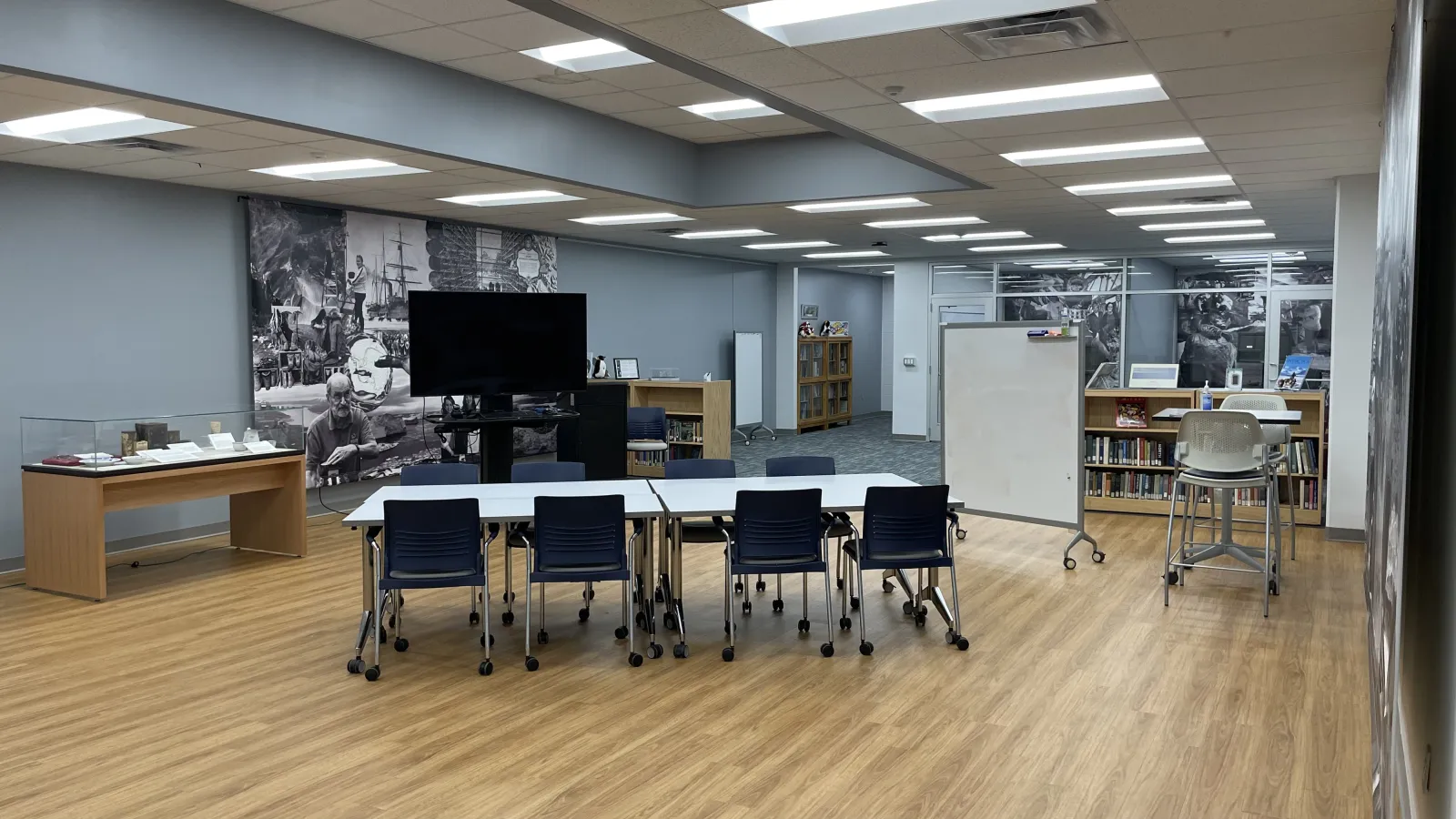 Inside the Goldthwait Polar Library with tables, chairs and typical library materials 