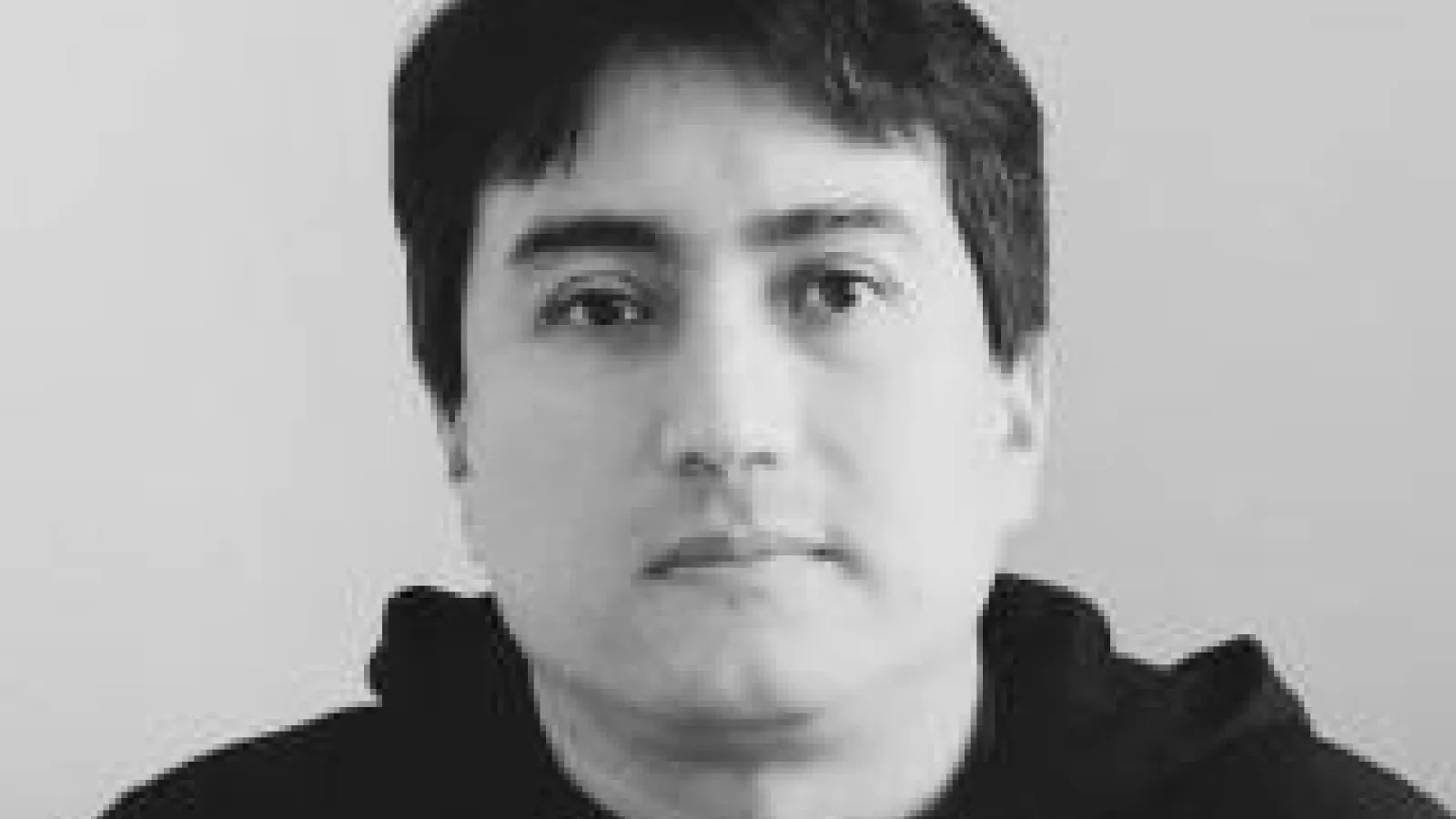 black and white headshot of gustavo