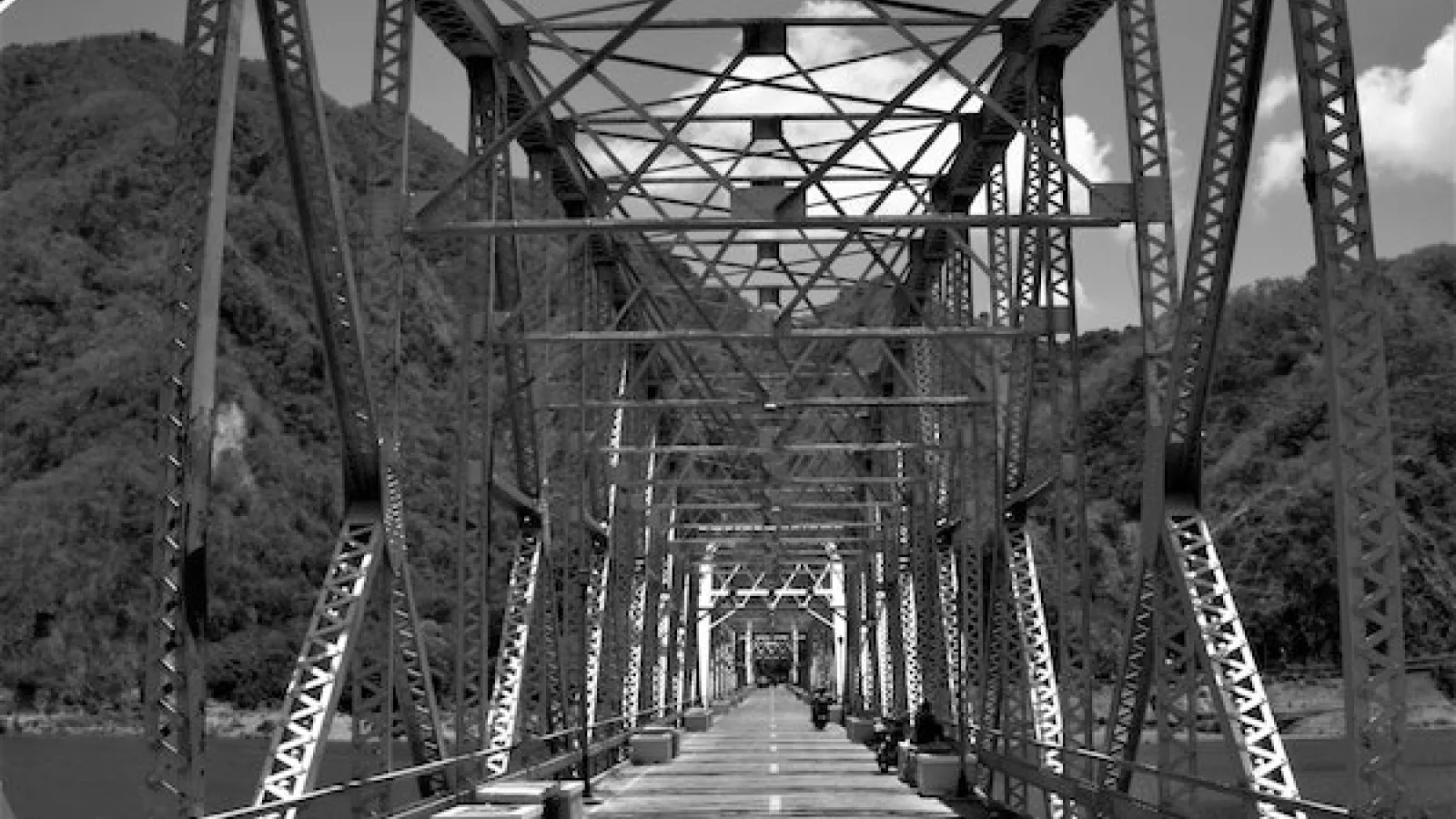 black and white image of a steel bridge