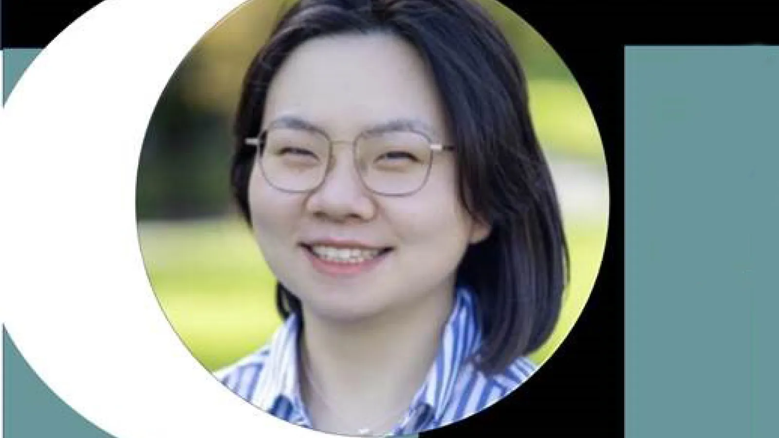 A pale, asian woman with shoulder length black hair and glasses wearing a stripped, collared shirt