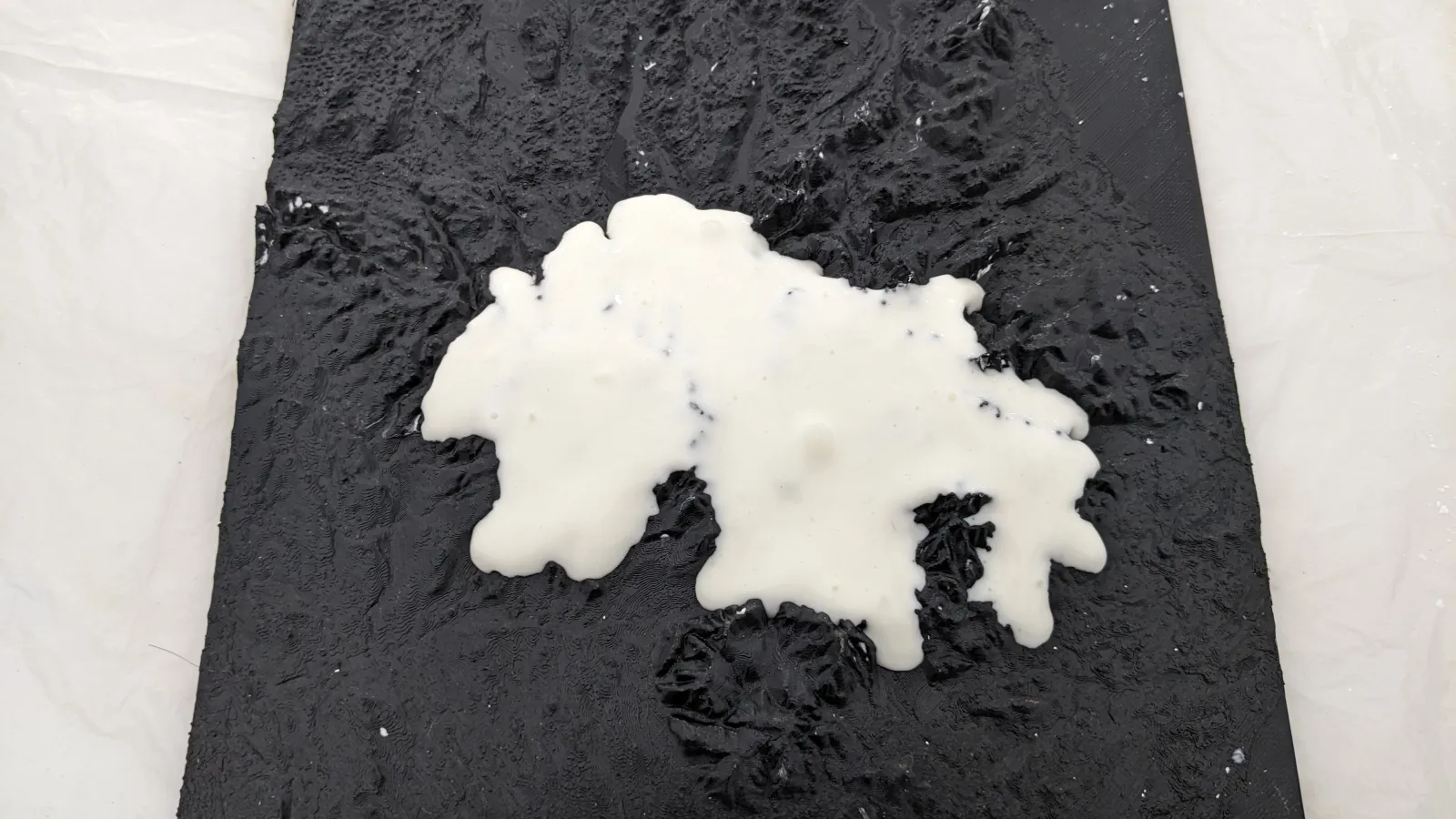 white flubber on a black background