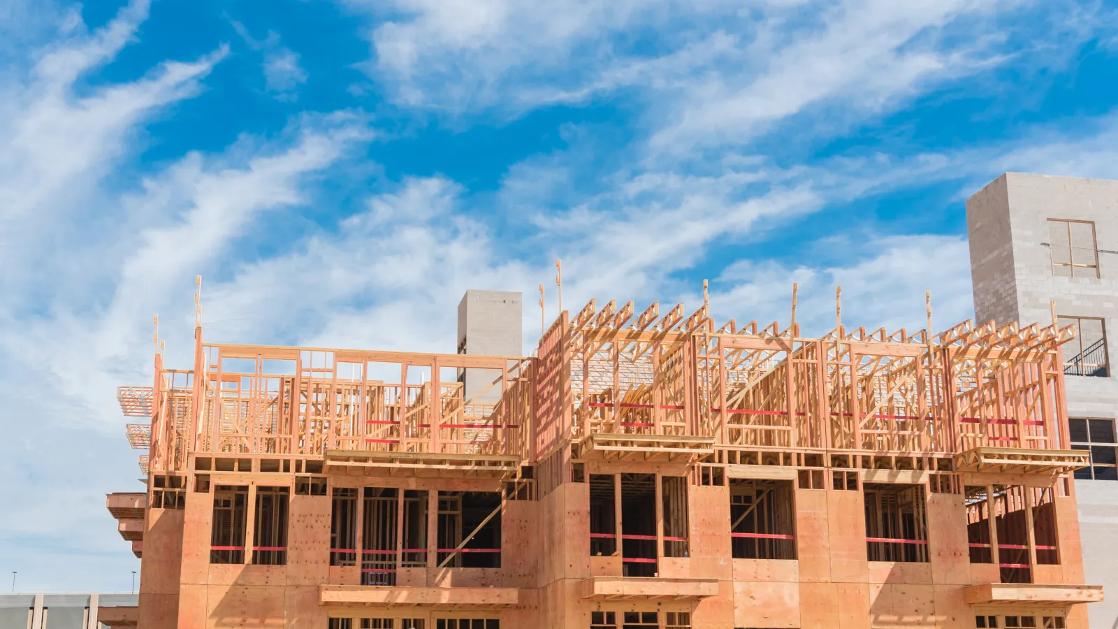 Wooden apartment building under construction.