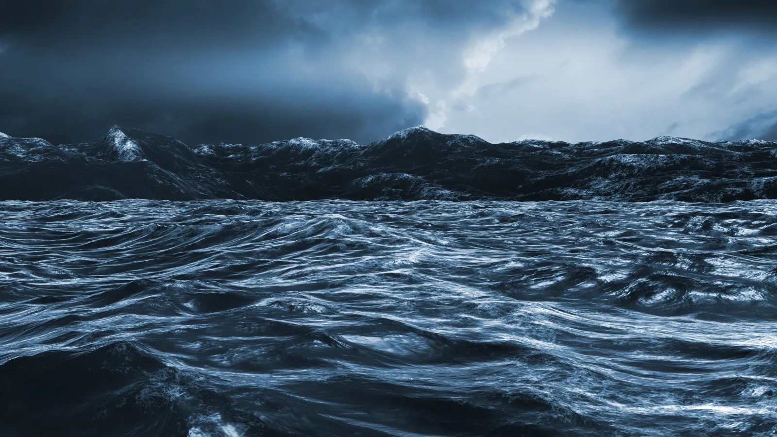 Rough dark blue ocean under a dark, cloudy sky.