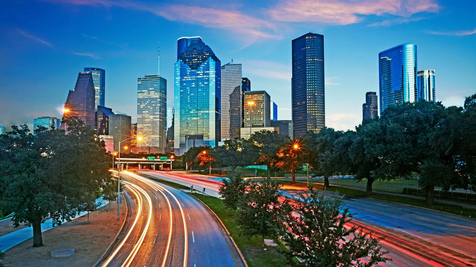 Skyline of the business district in Houston illuminated at dusk