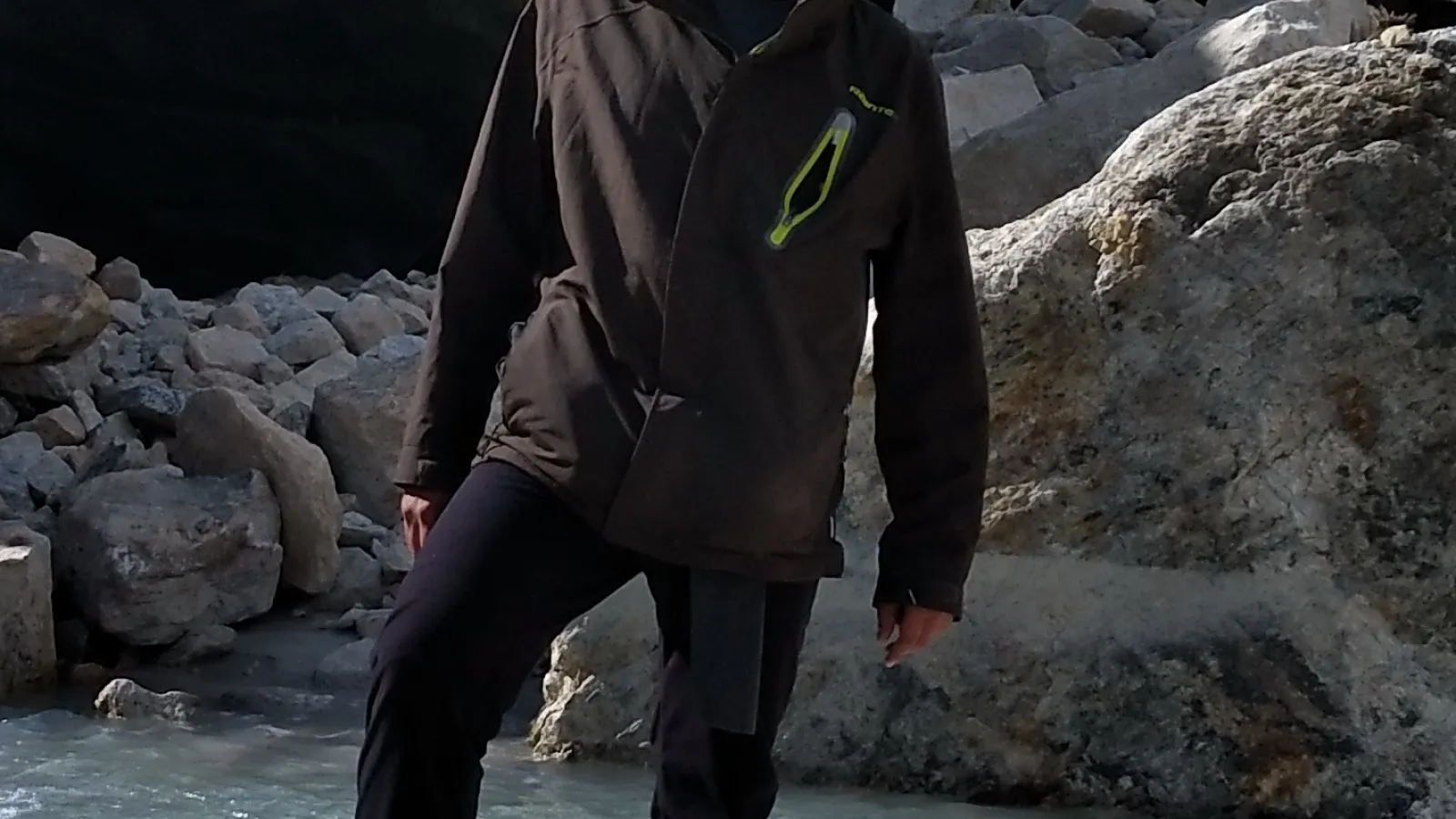 Man in hiking gear standing on a rock