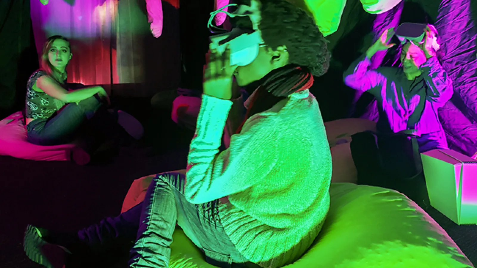 Students sitting in bean bags looking at VR headsets