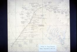 A charted course is drawn out in black ink over a pre-printed map of Antarctica. There is a line charting the course and markers with notes indicating when they reached that point and the coordinates. 