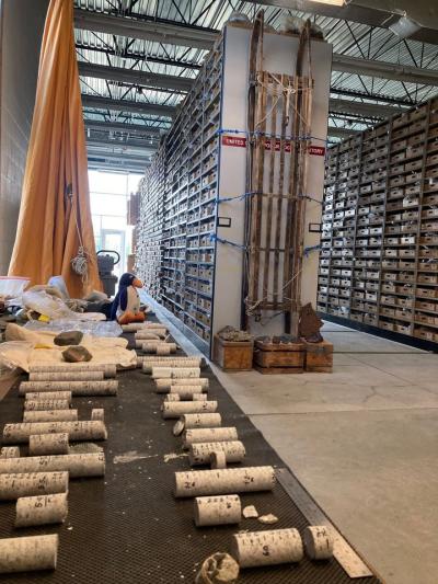 Inside the Polar Rock Repository with a table in the foreground and small, short cores on top.