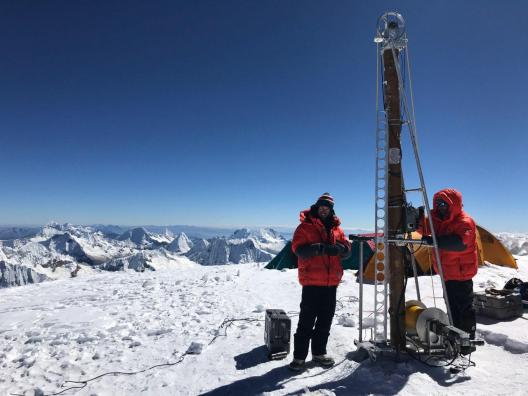 Schoessow and Kutuzov operate the ice core drill at the summit of Huascaran, Peru