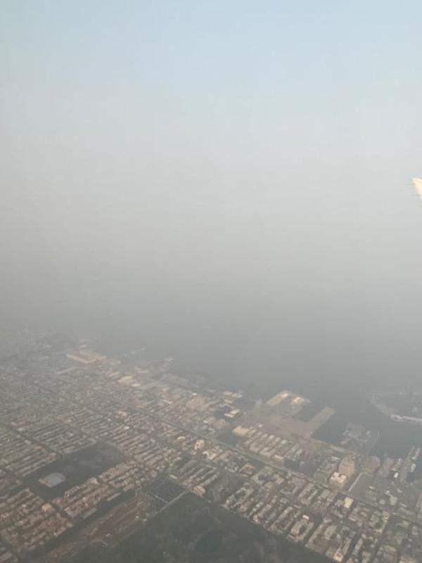 view of haze covering the city from above. 