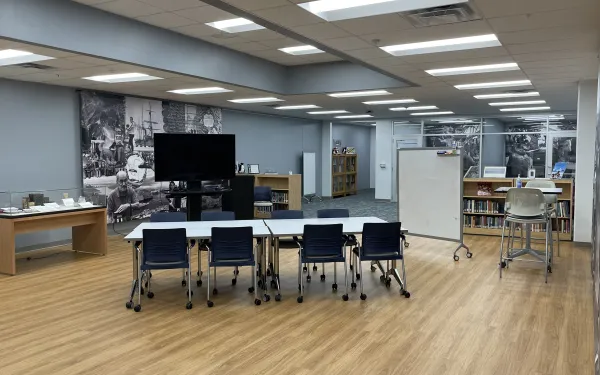 Inside the Goldthwait Polar Library with tables, chairs and typical library materials 