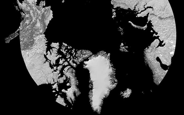 A hillshade rendering of ArcticDEM. It looks like the Arctic Circle with its landmasses rendered in white and grey against a black background.