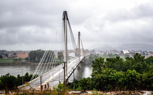 Ohio River Bridge from Kentucky to Portsmouth under cloudy skies.