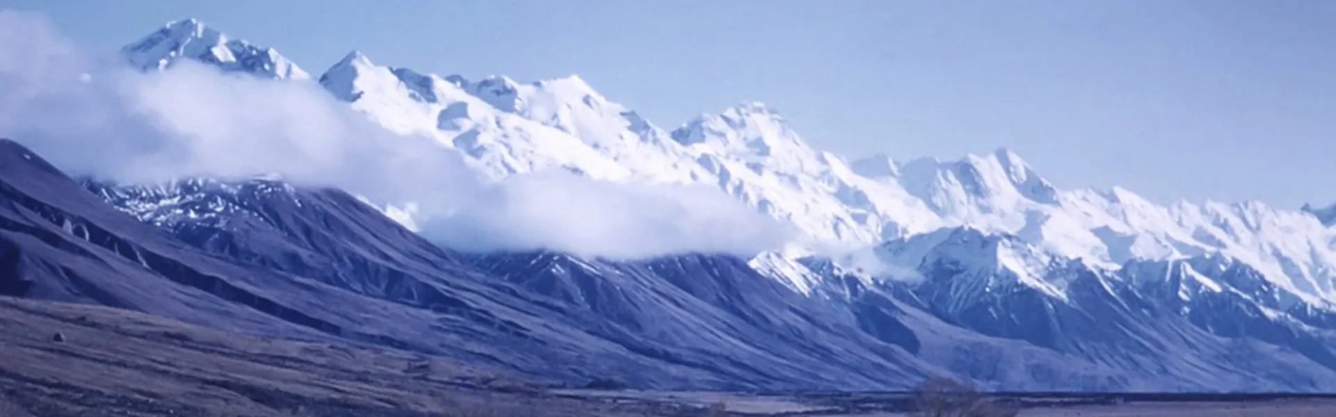 Ice-capped mountains and a blue sky.