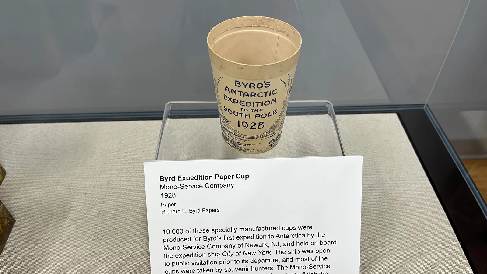 Byrd expedition paper cup with the text "Byrd's Antarctic Expedition to the South Pole 1928" on it.