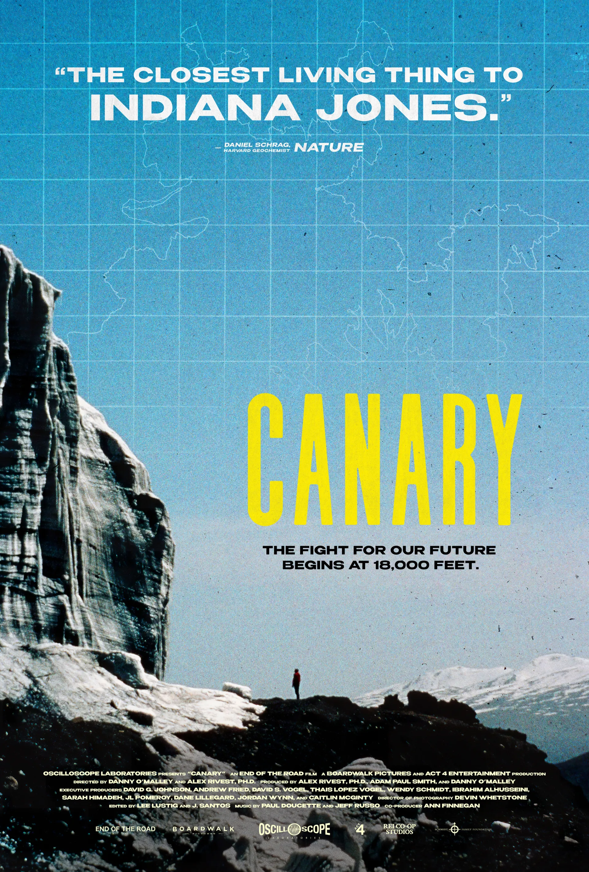 Poster of a man standing in a distance looking in front of him at a very tall wall of ice  under blue skies with snow covered mountains further in a distance and snow, rock and dirt on the ground.  in the sky is an outline representing a map. Text at the tops in white says "The closest living thing to Indiana Jones." - Daniel Schrag, Harvard Geochemist Nature . Large text in yellow says Canary, and under it says in black: The fight for our future begins at 18,000 feet.