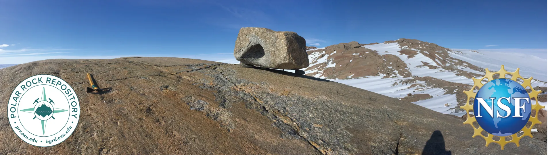 A boulder on top of a rock slab with snowy mountain in background with blue skies and logos of PRR and NSF on bottom left and right of image.