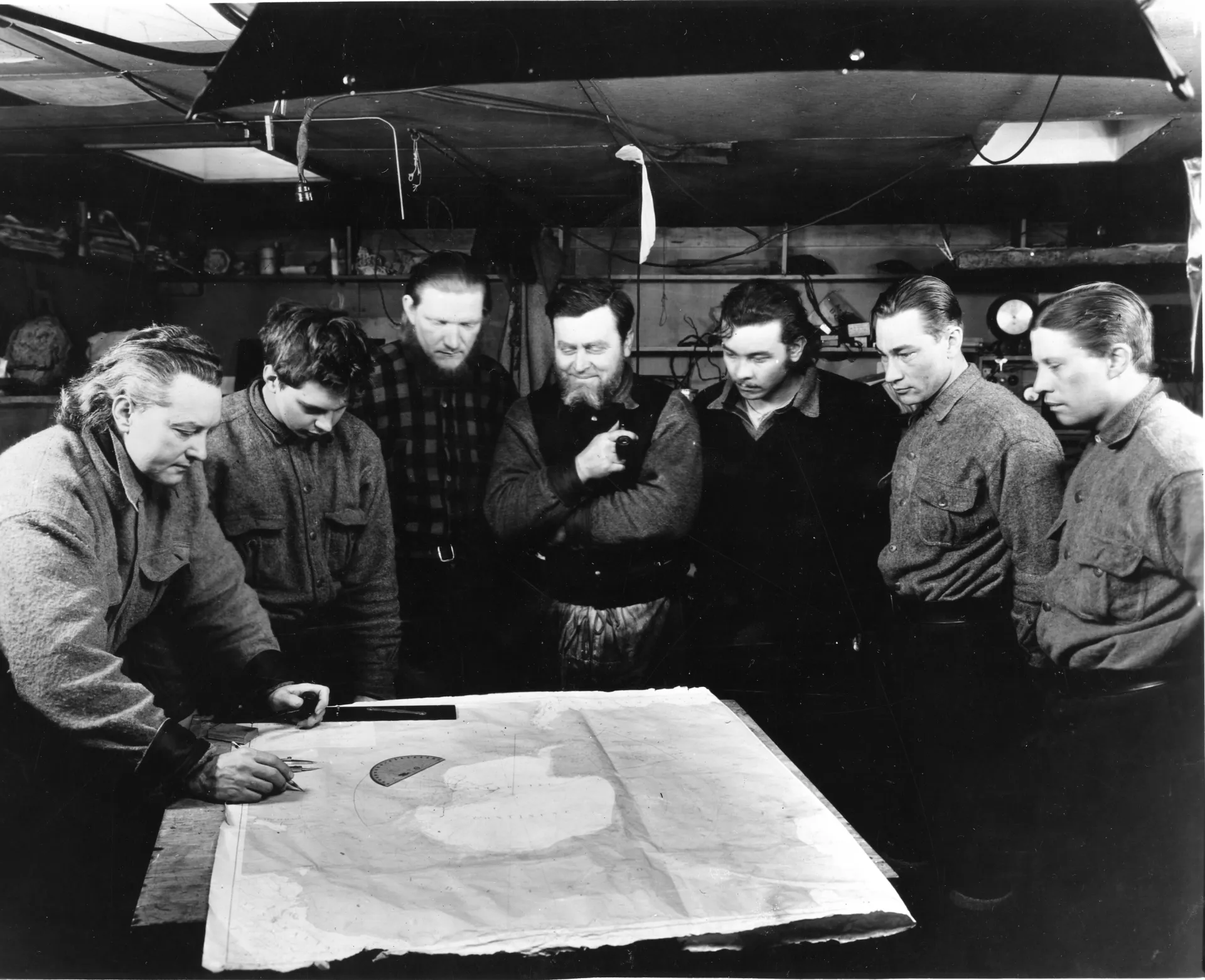The aviation department with the Chief looking at a map
