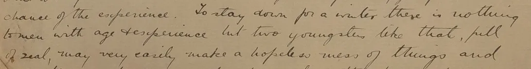 Close-up of a handwritten letter in cursive script on aged paper