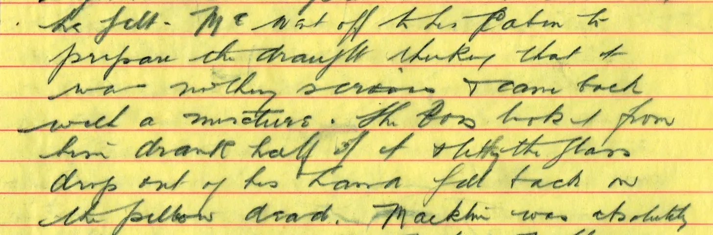 Close-up of cursive handwriting on yellow lined paper.