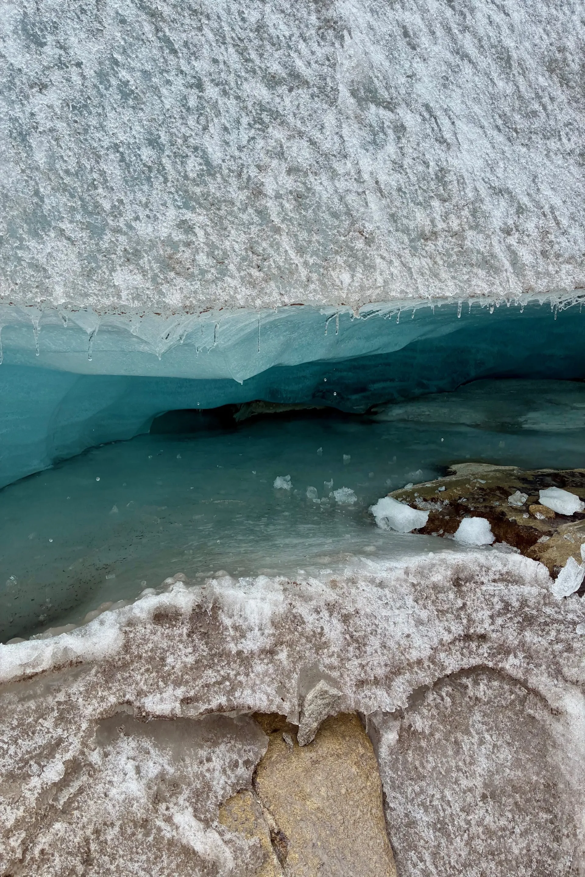 Water sits between a layer of bedrock and ice 