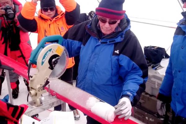 Lonnie Thompson cutting an ice core Lonnie using a saw to cut an ice core