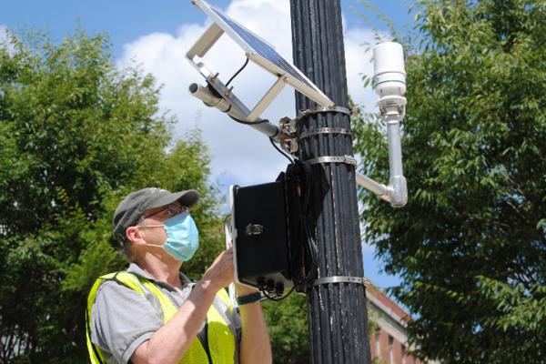 Jim DeGrand installs sensors around the OSU campus.