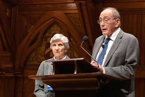 h Ellen Mosley-Thompson and Lonnie Thompson giving a presentation at a podium 