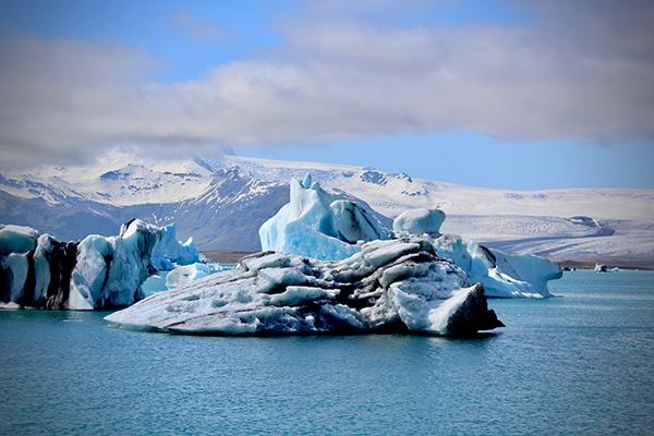 Glacier in a blue body of water 