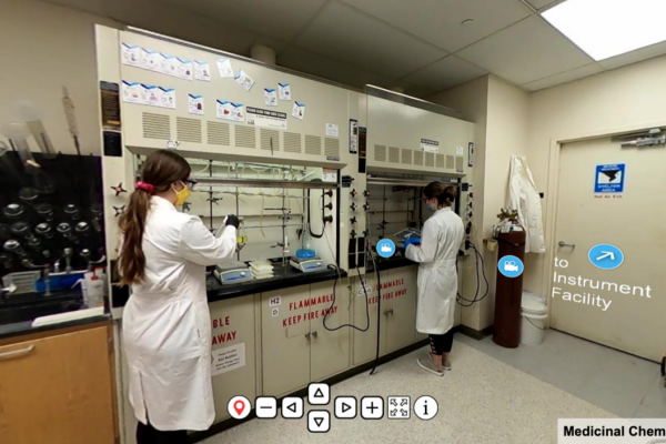 Scientist work in a lab in their lab coats