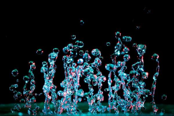 A microphotograph of moving drops of water.
