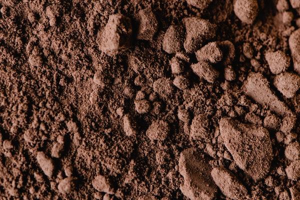 image or brown soil and brown rocks in ground