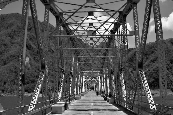 black and white image of a steel bridge
